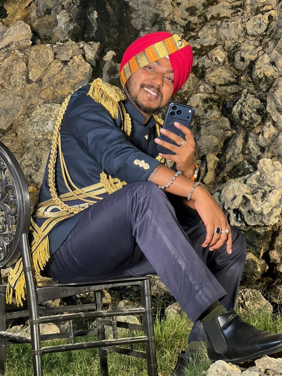 Band leader seated in navy uniform